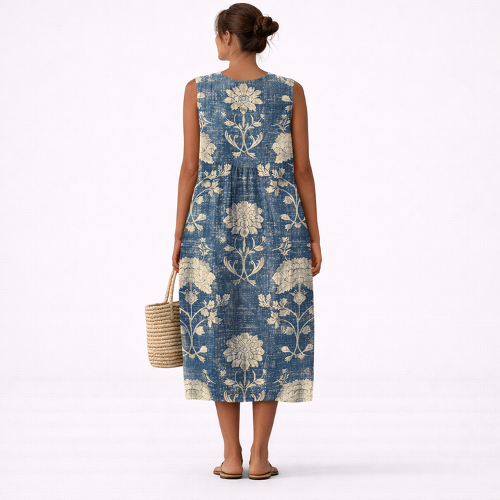 Elegante vestido midi floral sin mangas para mujer. Ofrece frescura y comodidad, ideal para eventos de verano.