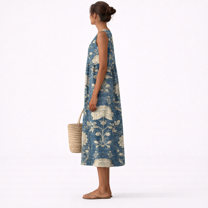 Vestido de verano midi para mujer con estampado floral. Sin mangas, fresco y cómodo, ideal para paseos y vacaciones.