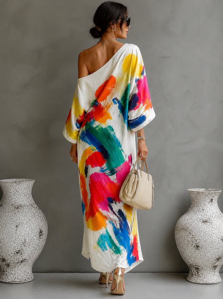 Vestido asimétrico de fiesta para mujer, con un original estampado artístico multicolor. Estilo fluido y veraniego.