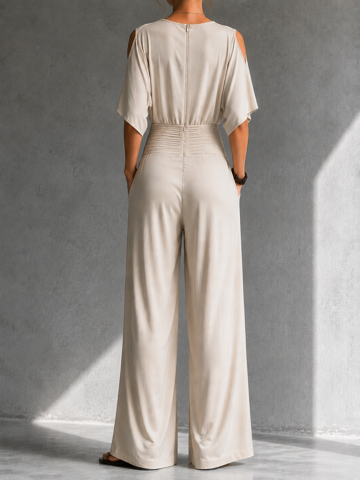 Mono de fiesta elegante para mujer, estilo fluido con escote cruzado y cintura fruncida, muy chic.