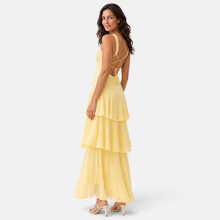Vestido largo de fiesta con volantes, ideal para eventos formales de mujer.