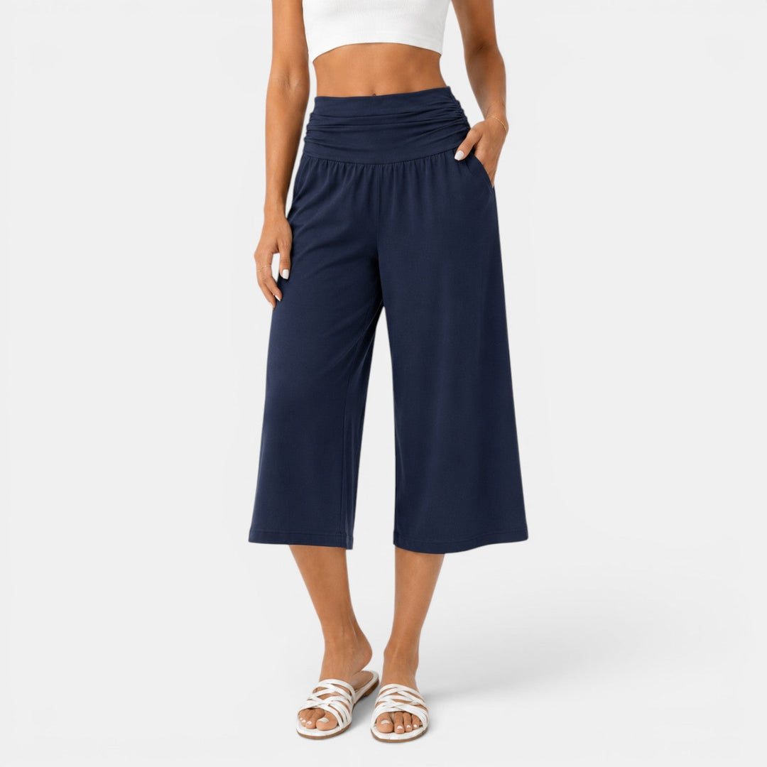 Capri deportivo negro para mujer, elástico. Ideal para yoga, fitness y entrenamiento transpirable y cómodo.
