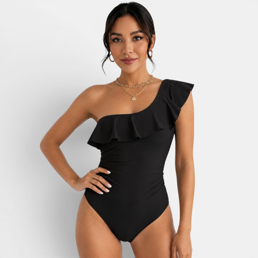 Bañador mujer asimétrico con volante, perfecto para playa y piscina. Elegancia veraniega.