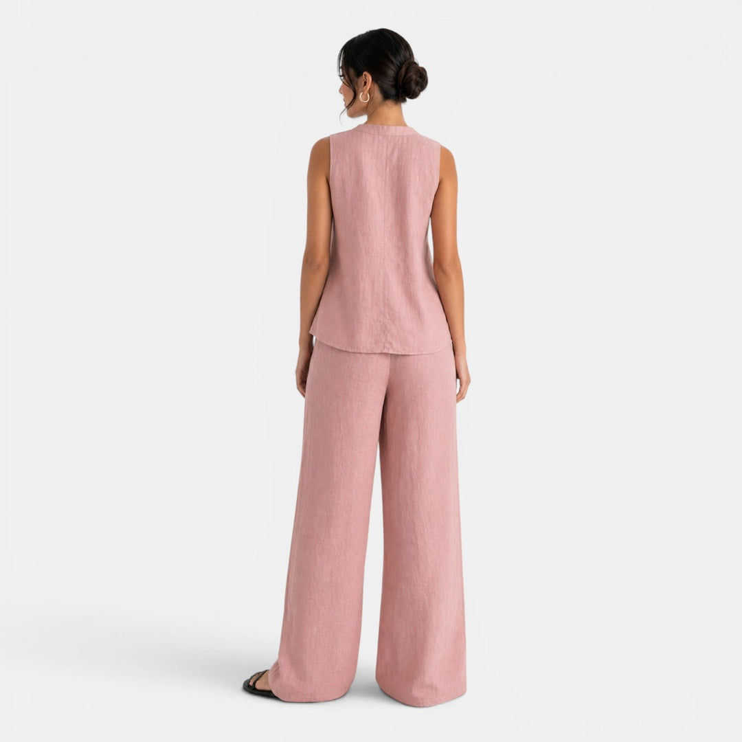 Pantalón de lino blanco de pierna ancha para mujer, combinando con chaleco a juego. Estilo cómodo de verano.