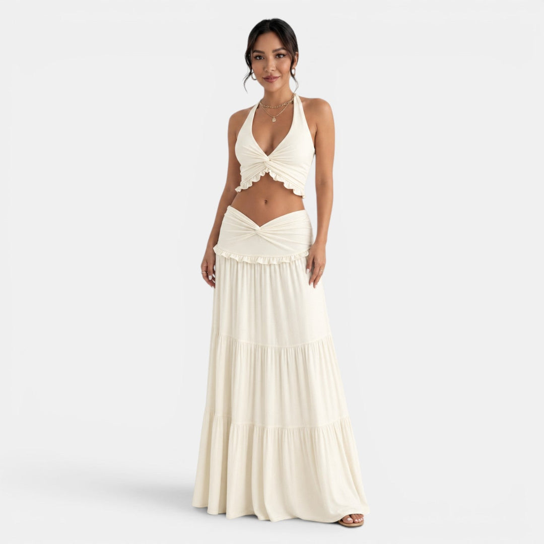Conjunto halter de mujer con falda larga de volantes, ideal para verano y ocasiones elegantes.