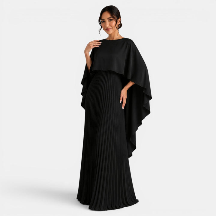 Vista trasera de un vestido largo casual para mujer, con distintivas mangas murciélago. Moda femenina versátil.