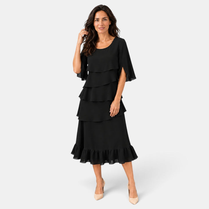 Vestido midi elegante para invitada de boda, con volantes y mangas abiertas. Ideal para eventos especiales.