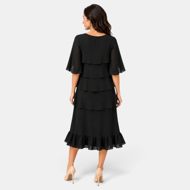 Vestido midi cómodo y chic para mujer, ideal como invitada de boda o para cualquier evento especial de día.
