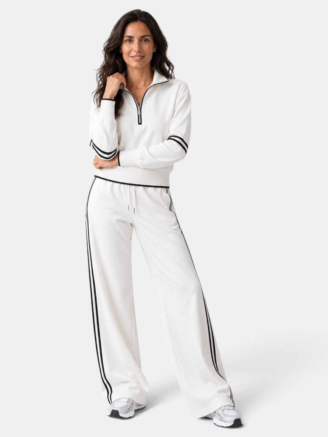 Conjunto de mujer con silueta fluida. Pantalón ancho y top de cuello alto. Ropa cómoda y chic para moda femenina.