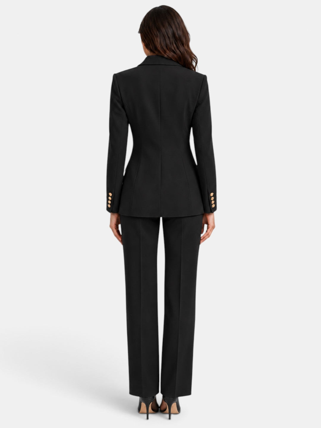 Mujer vistiendo traje blazer y pantalón ancho, ideal para reuniones de oficina y look formal.