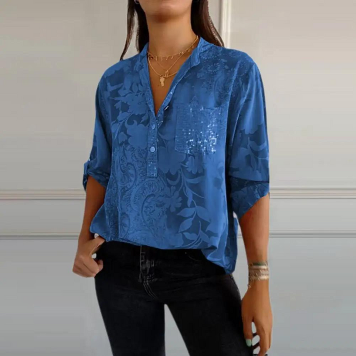 Camisa blusa floral mujer con estampado vibrante y bolsillo brillante. Manga larga, ideal para moda casual.