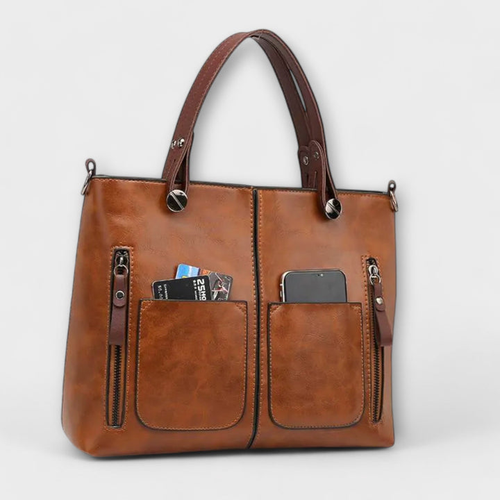 Bolso de mujer gris de piel sintética, espacioso y chic, ideal como bolso diario.