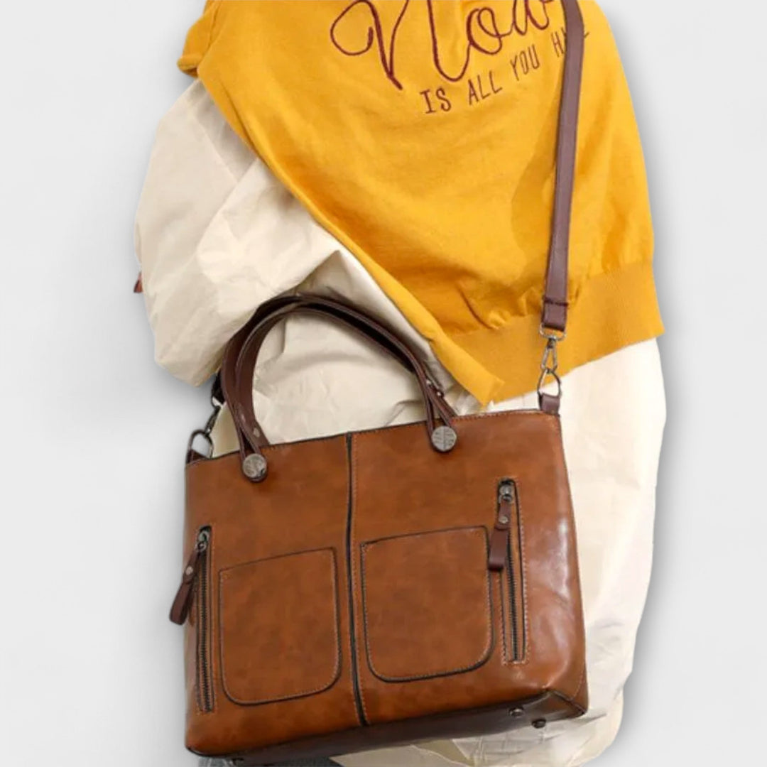 Bolso tote de piel sintética para mujer, duradero y versátil, con compartimentos.