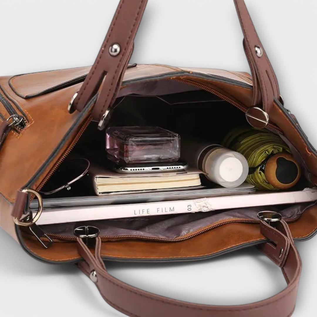 Bolso tote de mujer en color negro, diseño clásico en piel sintética, espacioso.
