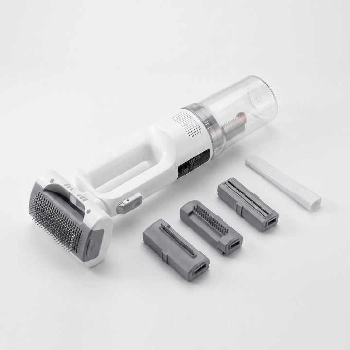 Cepillo aspirador inalámbrico para mascotas, ideal para acicalar y recoger pelo en sofás y alfombras.