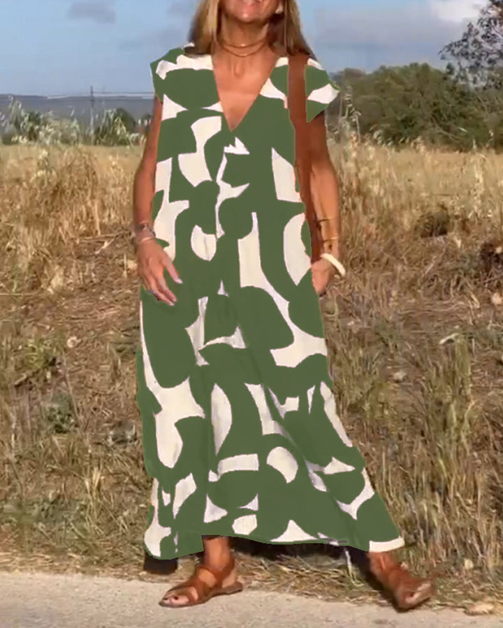 Vestido de poliéster fluido con estampado único, escote V. Moda cómoda para mujer.