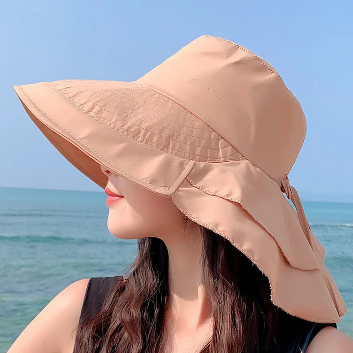 Sombrero mujer transpirable con ala ancha que ofrece protección UV esencial para el verano y vacaciones.