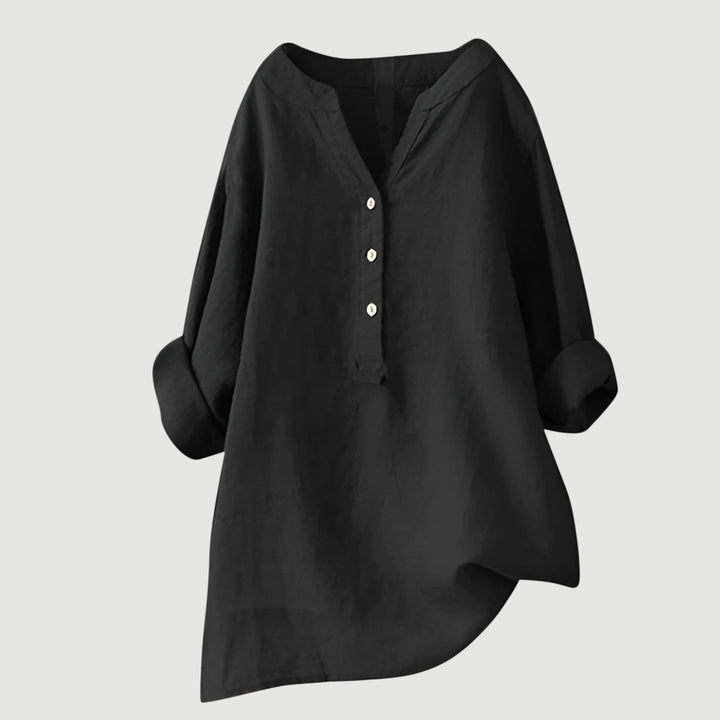 Blusa de mujer con cuello V pronunciado, manga larga. Estilo relajado y femenino.
