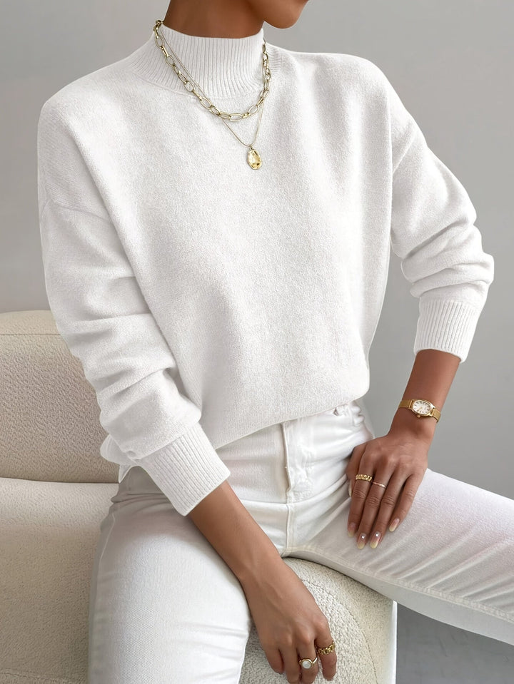 Suéter casual de punto grueso con cuello alto para mujer, manga larga, estilo relajado y moda femenina.