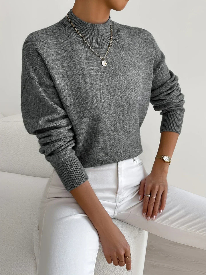 Moda de invierno: Jersey de mujer de punto grueso, cuello alto, manga larga, combinación perfecta de estilo y confort.