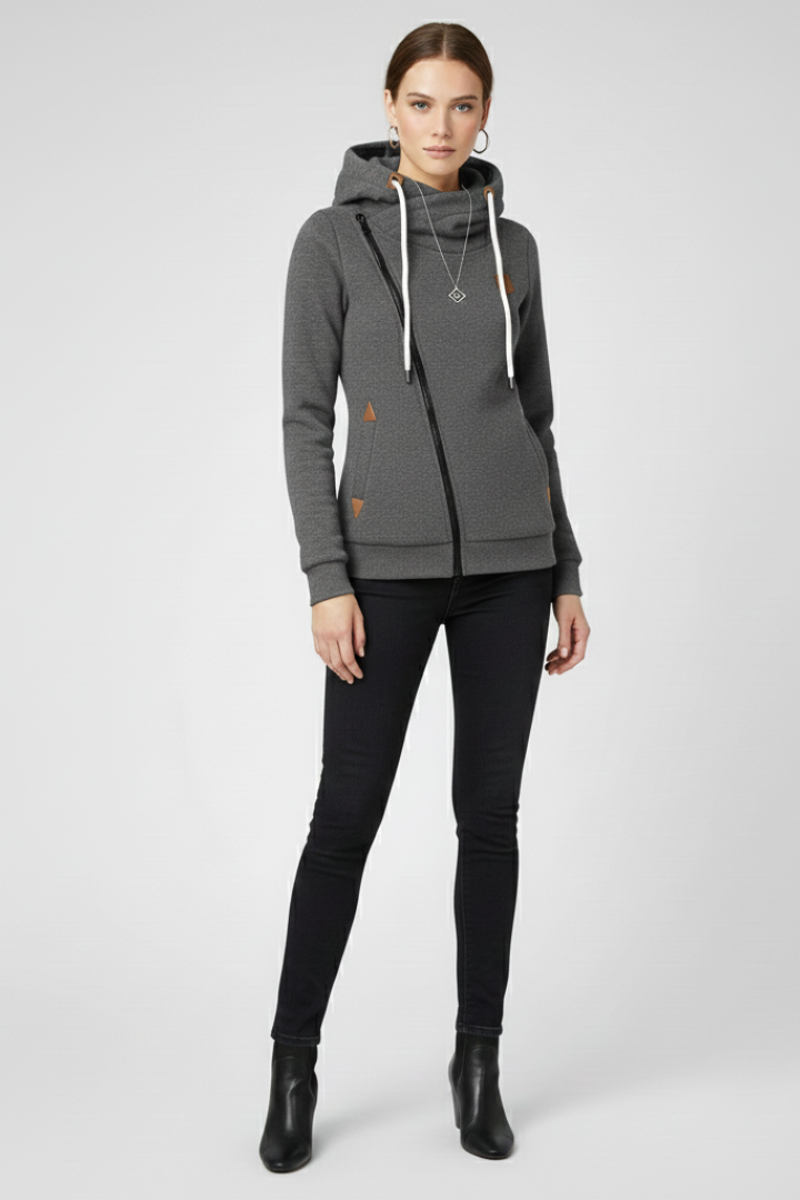 Chaqueta sudadera asimétrica para mujer con cremallera y capucha. Moda urbana moderna y confortable.