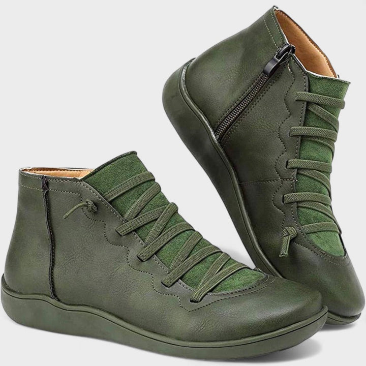 Botines de mujer con cordones ajustables y cremallera lateral. Calzado de tobillo casual, ideal para comodidad y estilo.