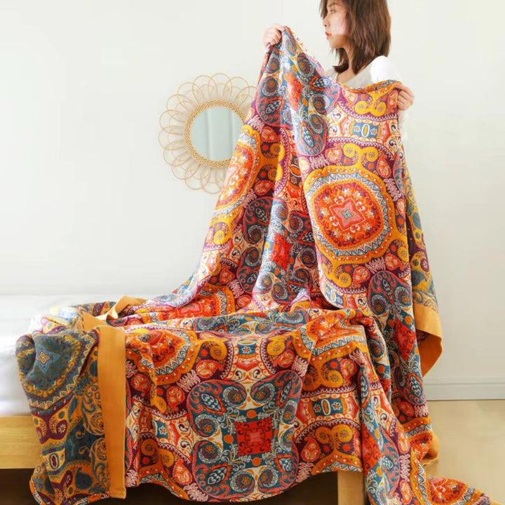 Manta de algodón boho para sofá, con patrón Amanecer. Ideal para añadir estilo reversible y cálido a tu salón.