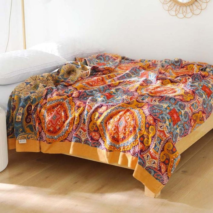 Manta reversible de algodón boho "Amanecer". Perfecta para sofá, cama, o como decoración versátil en cualquier espacio.