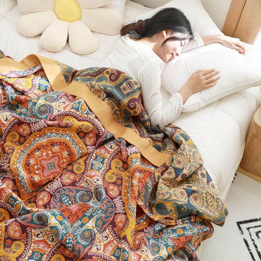 Manta de algodón transpirable estilo boho, diseño Amanecer. Suave y reversible, ideal para sofá, cama o picnic.