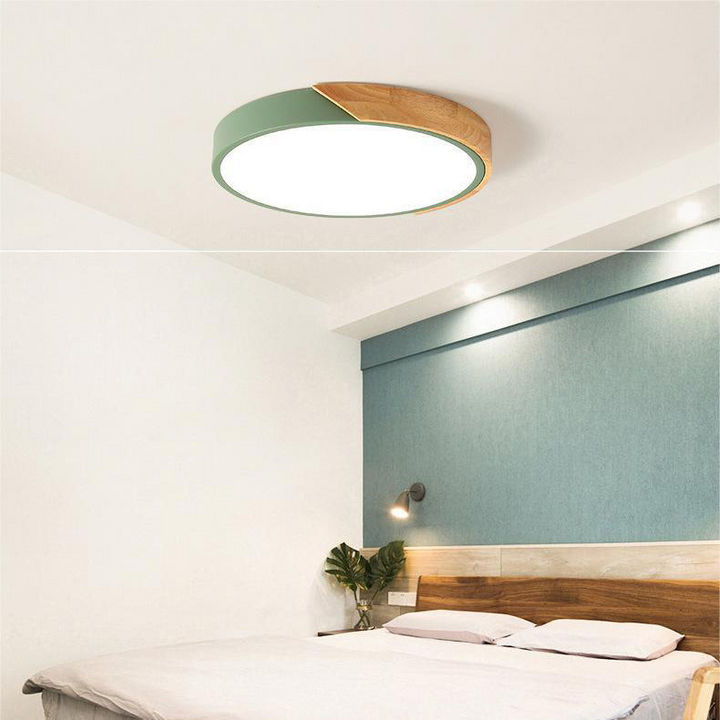 Lámpara de techo LED circular para oficina o espacio moderno, luz ajustable y diseño limpio.