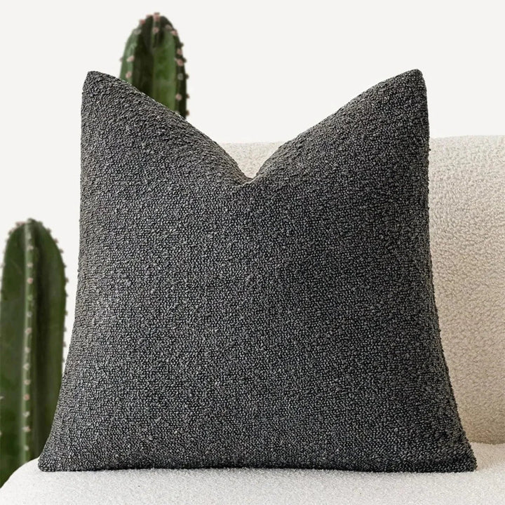 Funda cojín boucle con textura acogedora 45x45cm. Ideal para añadir calidez y estilo.
