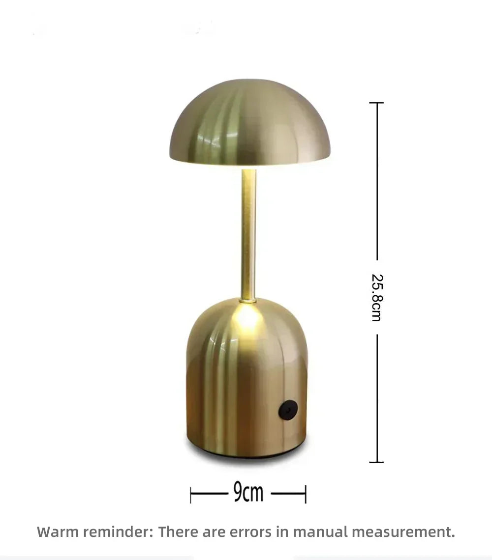 Lámpara LED portátil recargable, inalámbrica, ideal como luz de lectura o para ambiente acogedor.