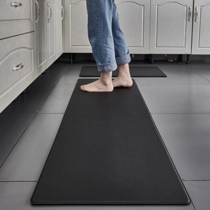 Tapete de cocina impermeable de PVC, fácil limpieza. Superficie antifatiga para confort diario en cualquier cocina.