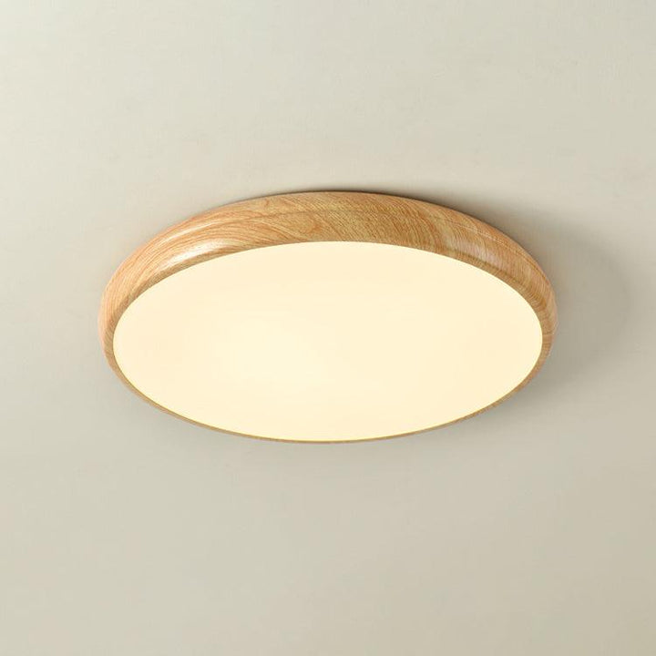 Lámpara de techo LED con detalle de veteado madera, iluminación moderna y funcional.