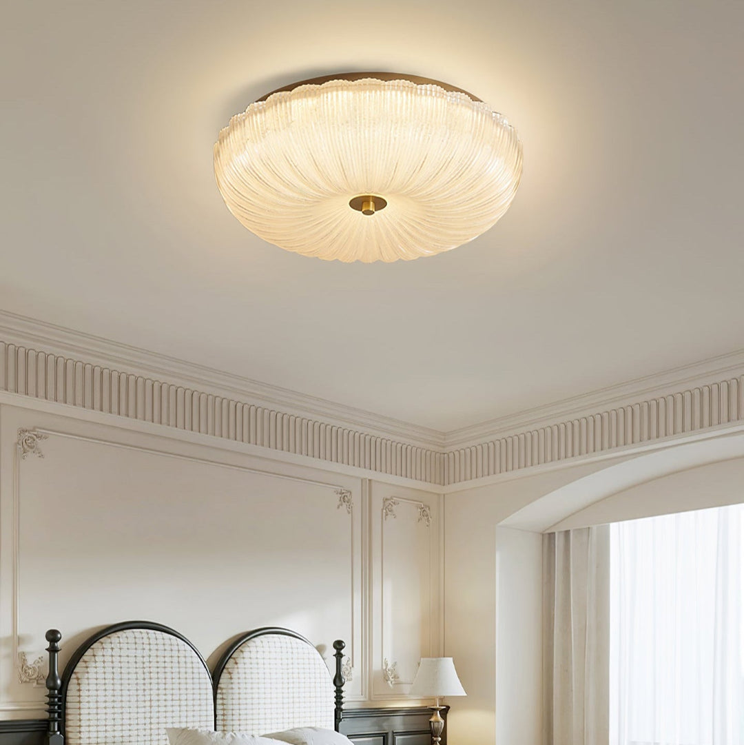 Iluminación interior versátil con plafón LED, vidrio ondulado, cambio de color y luz ajustable.