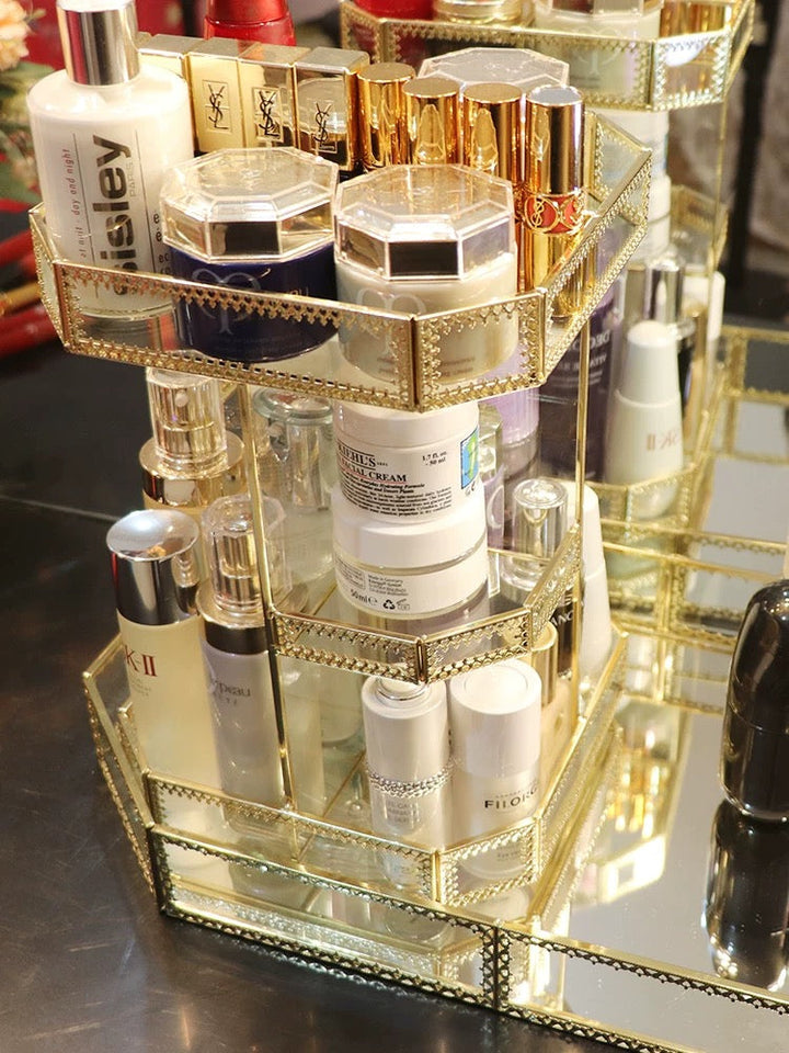 Lujoso organizador giratorio de vidrio dorado para tocador, realza tu vanity con estilo y elegancia vintage.