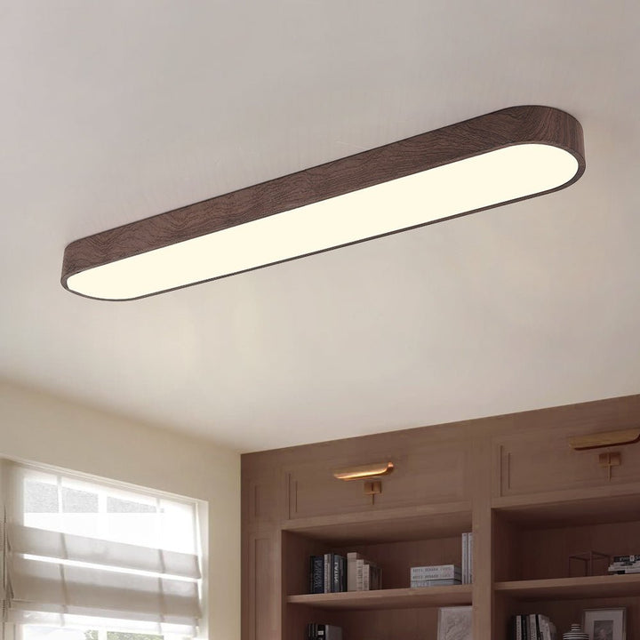 Plafón LED ovalado con luz ajustable. Iluminación de techo eficiente y cálida para espacios modernos.