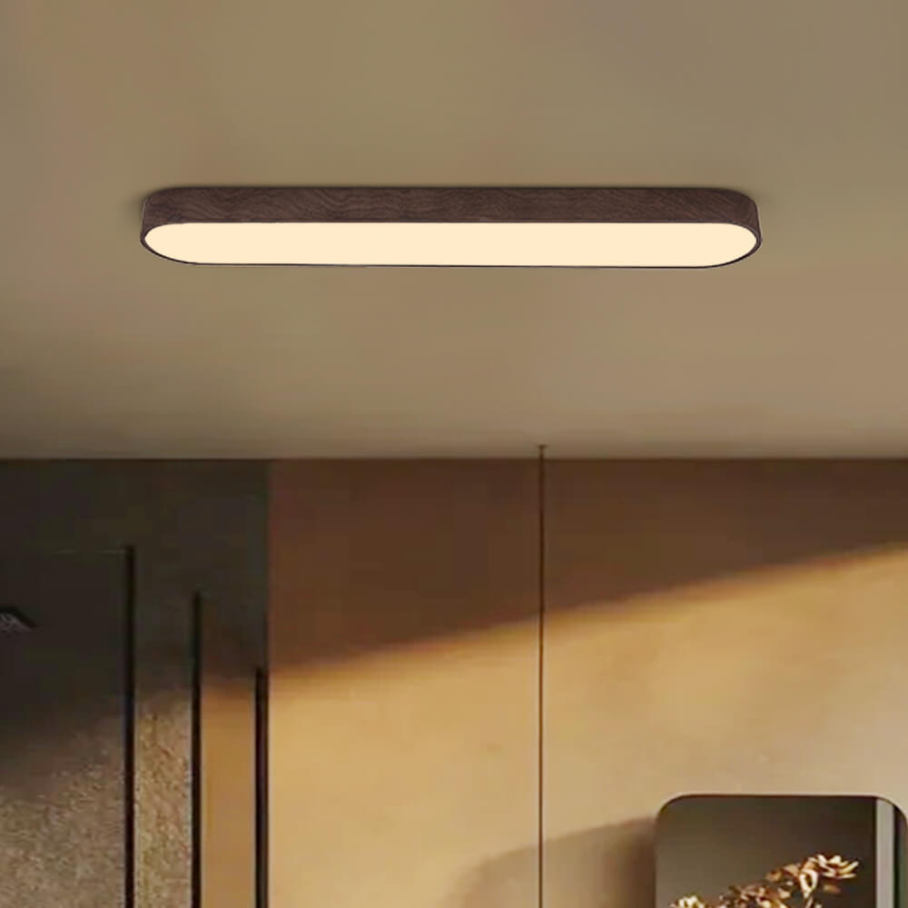 Detalle de plafón LED ovalado Japandi. Acabado minimalista, ideal para decoración de interiores modernos.