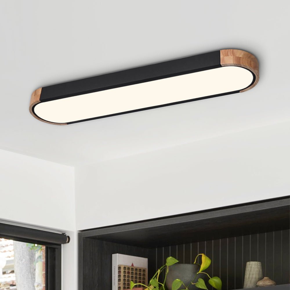 Elegante luz de techo LED ovalada estilo Japandi, de montaje empotrado para interiores minimalistas.