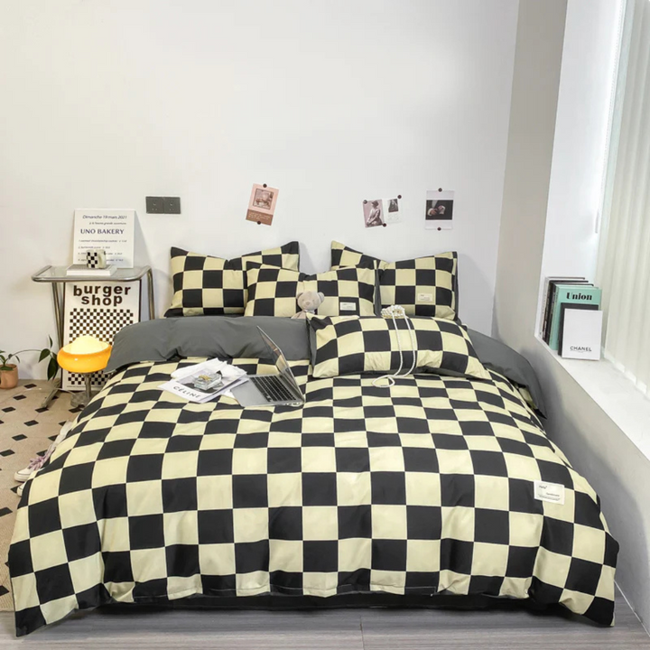 Funda nórdica contemporánea con patrón de ajedrez. Textil de cama moderno en blanco y negro para habitaciones.