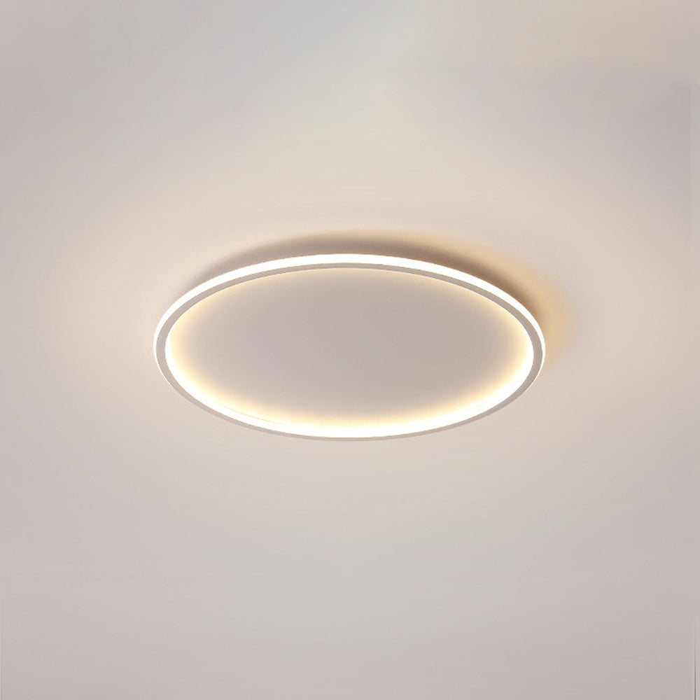 Foco de techo LED moderno y minimalista, lámpara redonda con iluminación de halo para un hogar estilizado.