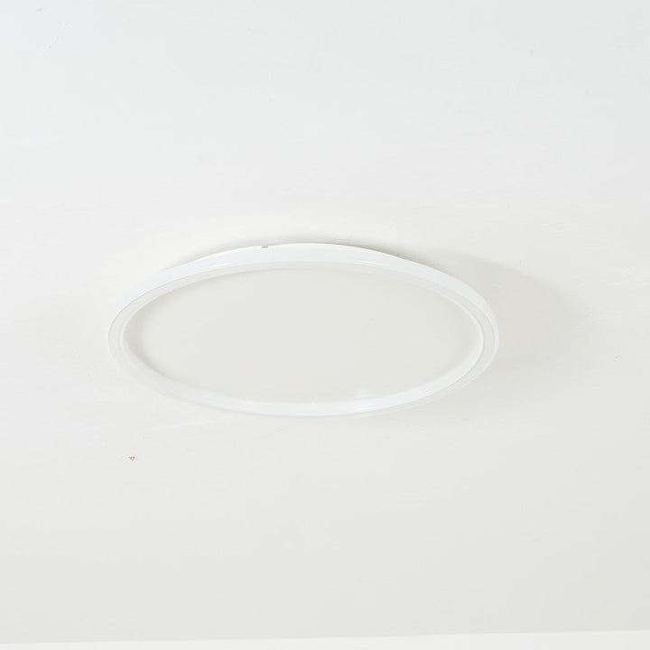 Lámpara de techo redonda LED con halo de luz, tecnología moderna para iluminación interior eficiente.