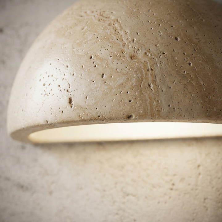 Aplique de pared LED moderno en piedra, forma semicircular, para luz cálida e indirecta.