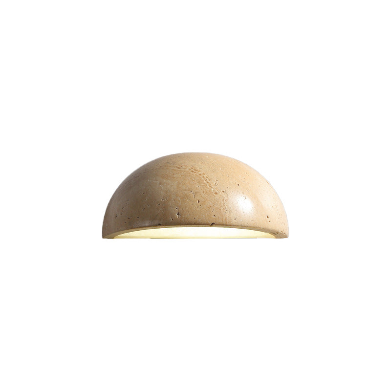 Aplique LED semicircular de piedra, disponible en tonos beige y negro para luz ambiental.