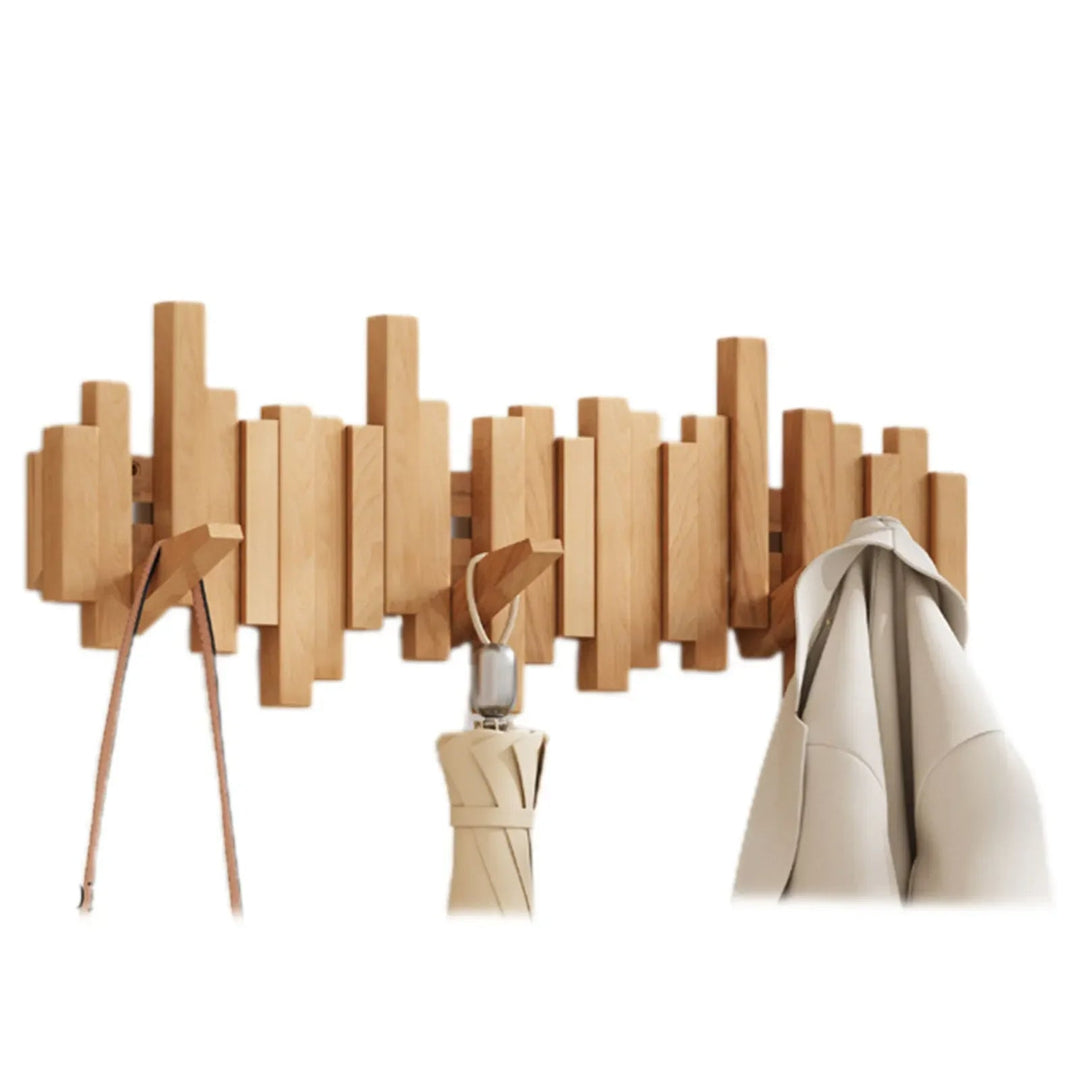 Perchero de pared moderno con ganchos plegables para ahorrar espacio en el recibidor.