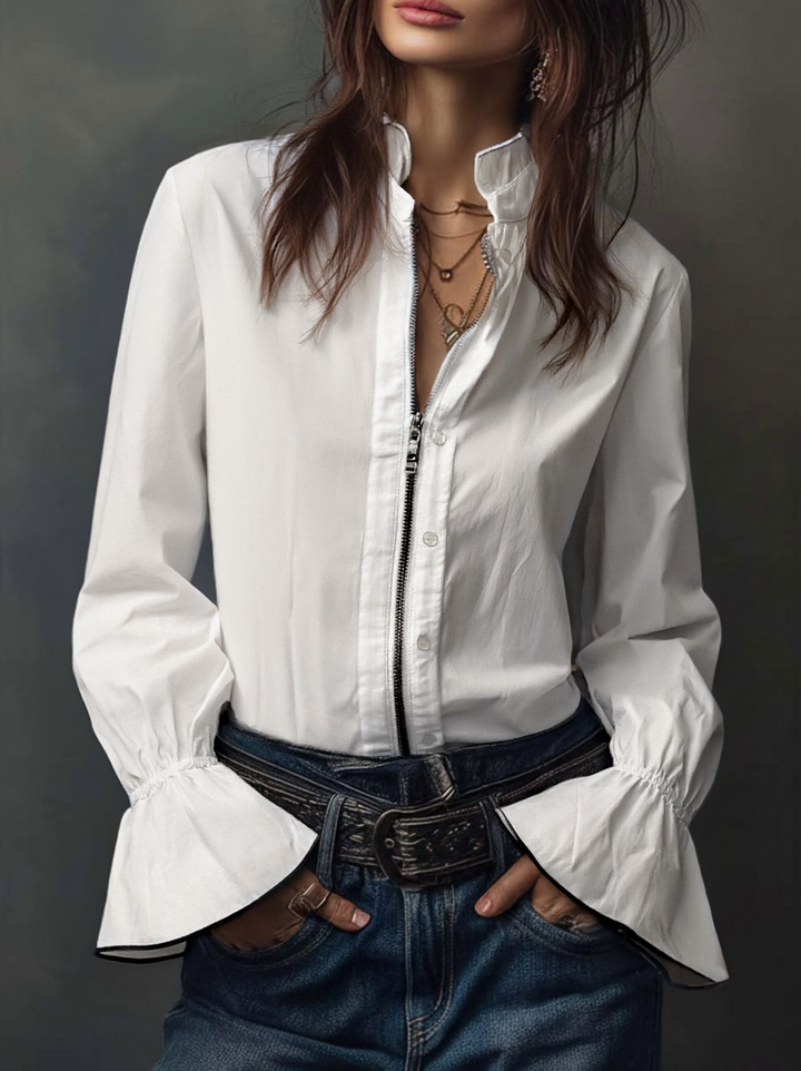 Elegante blusa de mujer manga larga, cremallera en cuello camisero. Prenda chic para cualquier ocasión.