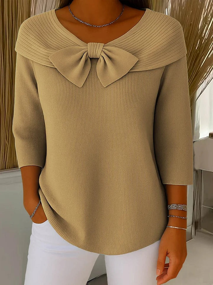 Blusa de mujer manga larga con cuello en V y detalle de lazo. Ideal para ropa de día y moda casual elegante.