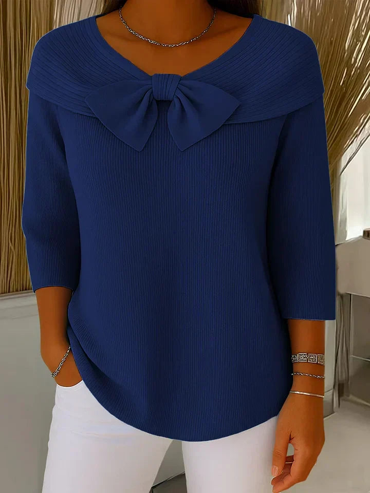 Blusa elegante femenina con lazo en el cuello y mangas largas. Estilo casual chic para la temporada de primavera.