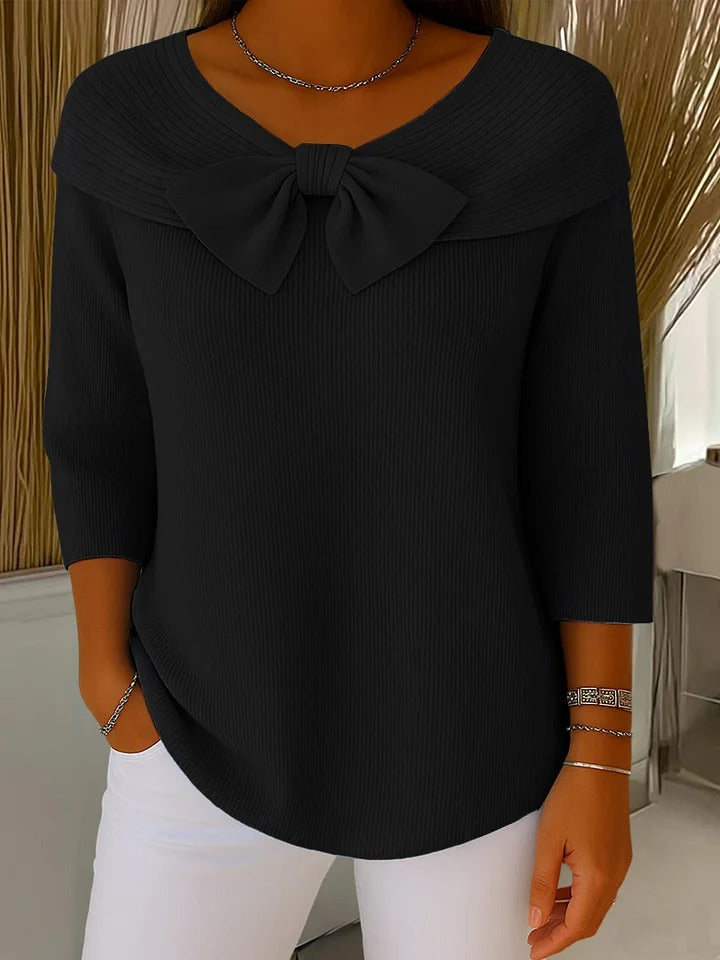 Blusa texturizada de mujer con manga larga y cuello V. Con lazo delantero, ideal para un look casual de primavera.