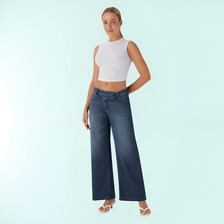 Pantalones vaqueros elásticos mujer, tiro bajo asimétrico. Comodidad y moda en azul denim.